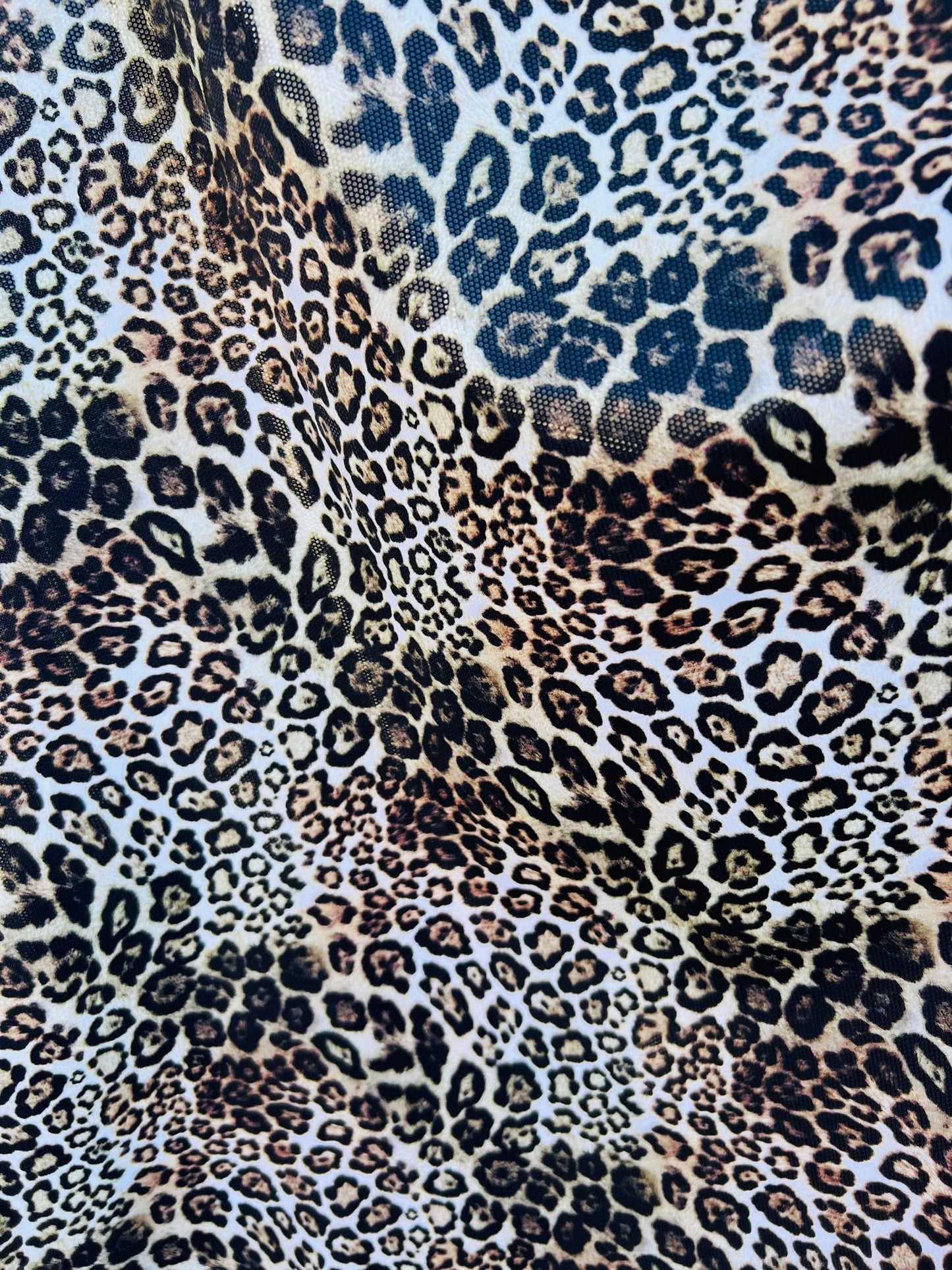 Exotic Leopard design Italian nylon spandex 4-way stretch with clear foil 58/60” Sold by the YD. Ships Worldwide from Los Ángeles California