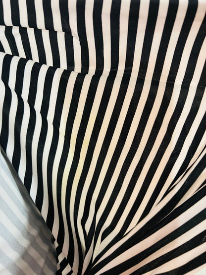 Striped design 1/2” White/Black print on great quality of nylon spandex 4-way stretch 58/60” Sold by the YD. Ships Worldwide from L.A