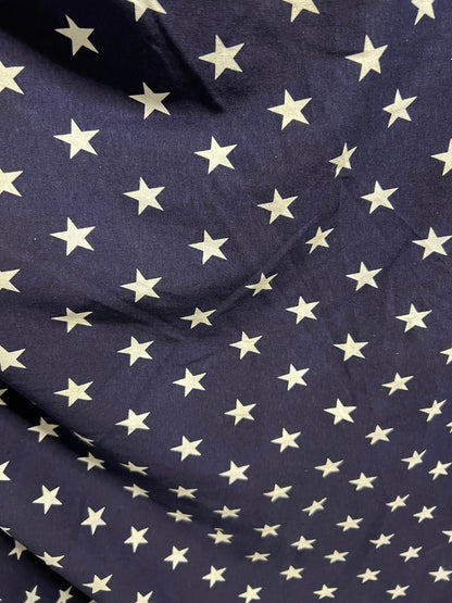 Freedom stars design print on cotton jersy 2-way stretch 58/60” Navy blue/White. Sold by the YD.