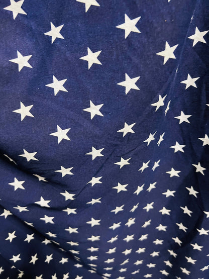 Freedom stars design print on cotton jersy 2-way stretch 58/60” Navy blue/White. Sold by the YD.