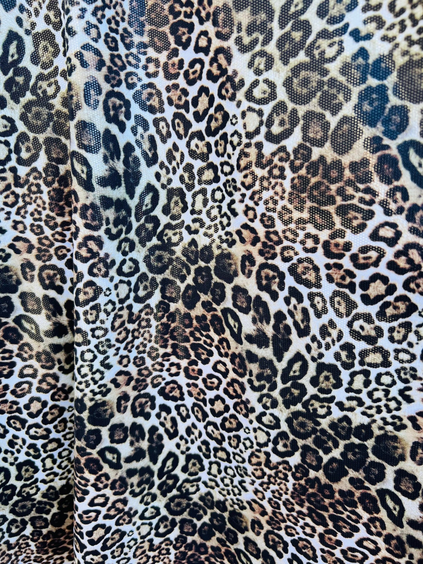 Exotic Leopard design Italian nylon spandex 4-way stretch with clear foil 58/60” Sold by the YD. Ships Worldwide from Los Ángeles California