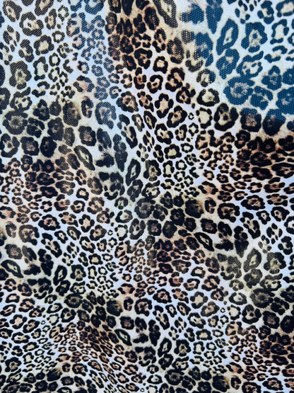 Exotic Leopard design Italian nylon spandex 4-way stretch with clear foil 58/60” Sold by the YD. Ships Worldwide from Los Ángeles California