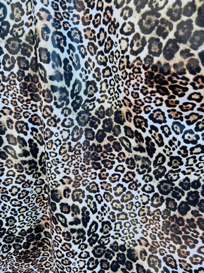 Exotic Leopard design Italian nylon spandex 4-way stretch with clear foil 58/60” Sold by the YD. Ships Worldwide from Los Ángeles California