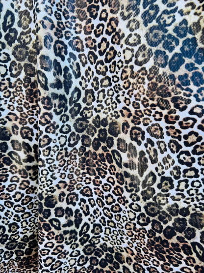 Exotic Leopard design Italian nylon spandex 4-way stretch with clear foil 58/60” Sold by the YD. Ships Worldwide from Los Ángeles California