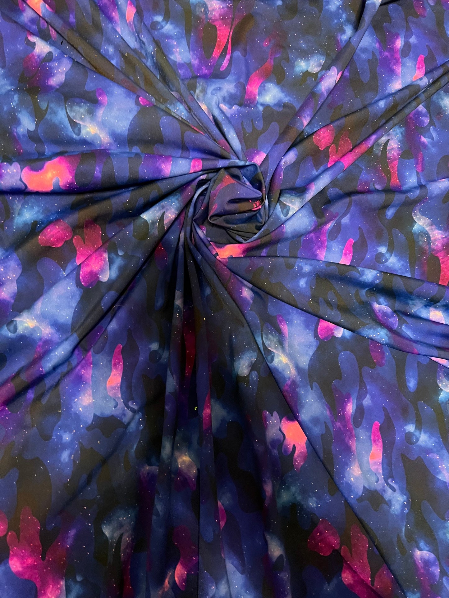 Camouflage UV-light it glows in the dark with black light great quality of nylon spandex 4-way stretch 58/60” Sold by the YD.