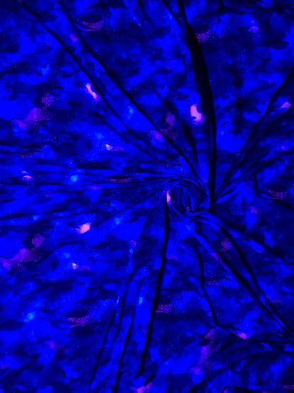 Camouflage UV-light it glows in the dark with black light great quality of nylon spandex 4-way stretch 58/60” Sold by the YD.