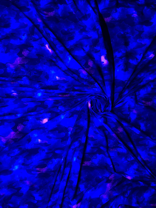 Camouflage UV-light it glows in the dark with black light great quality of nylon spandex 4-way stretch 58/60” Sold by the YD.