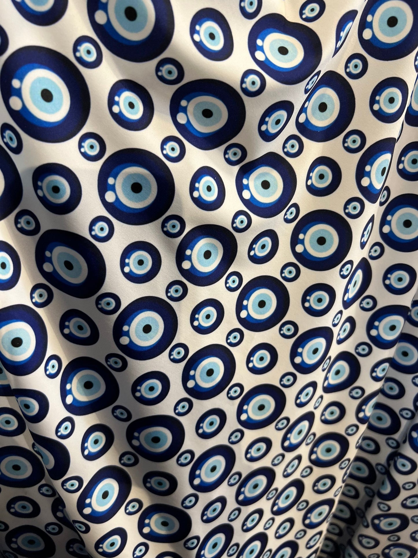 New Nazar Eye-Shape design print on great quality of nylon spandex 4-way stretch 58/60” Sold by the YD. Ships Worldwide from Los Angeles CA