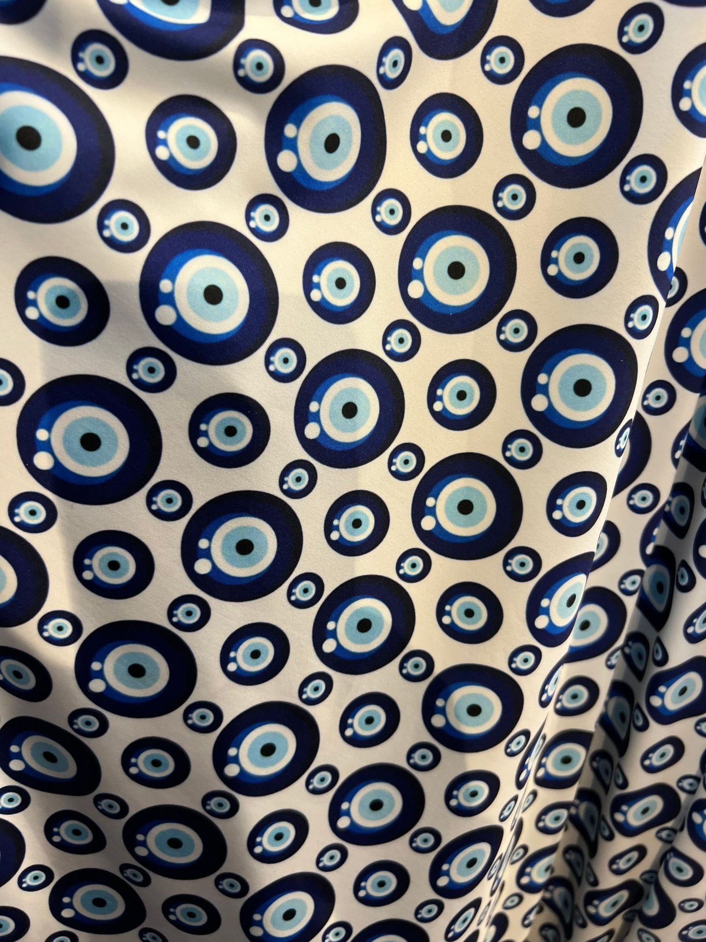 New Nazar Eye-Shape design print on great quality of nylon spandex 4-way stretch 58/60” Sold by the YD. Ships Worldwide from Los Angeles CA