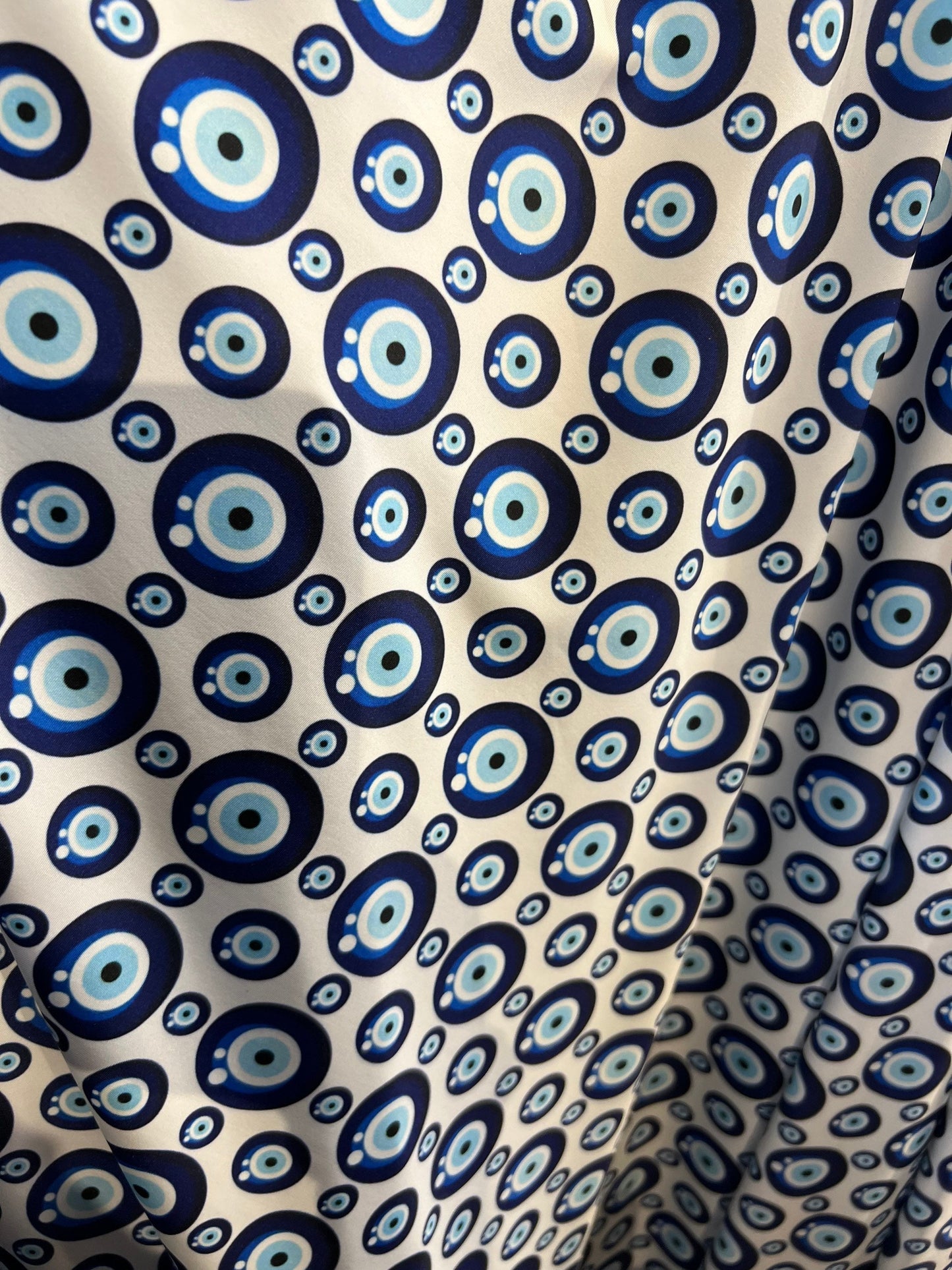 New Nazar Eye-Shape design print on great quality of nylon spandex 4-way stretch 58/60” Sold by the YD. Ships Worldwide from Los Angeles CA