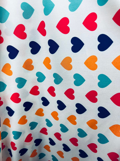 Romantic Hearts design white/multicolor print on great quality of nylon spandex 4-way stretch 58/60” Sold by the YD. Ships  Worldwide