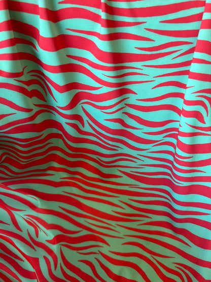 New Exotic zebra design Green/Red print on great quality of nylon spandex 4-way stretch 58/60” Sold by the YD. Ships Worldwide from L.A