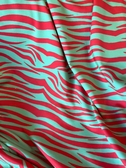 New Exotic zebra design Green/Red print on great quality of nylon spandex 4-way stretch 58/60” Sold by the YD. Ships Worldwide from L.A