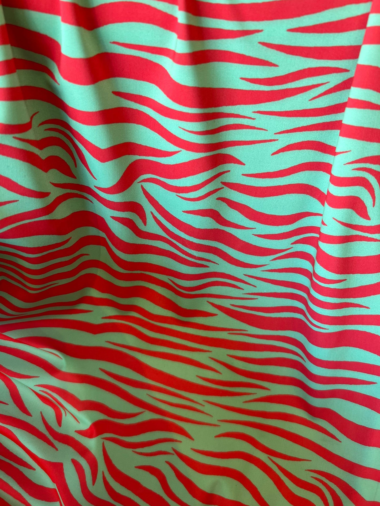 New Exotic zebra design Green/Red print on great quality of nylon spandex 4-way stretch 58/60” Sold by the YD. Ships Worldwide from L.A