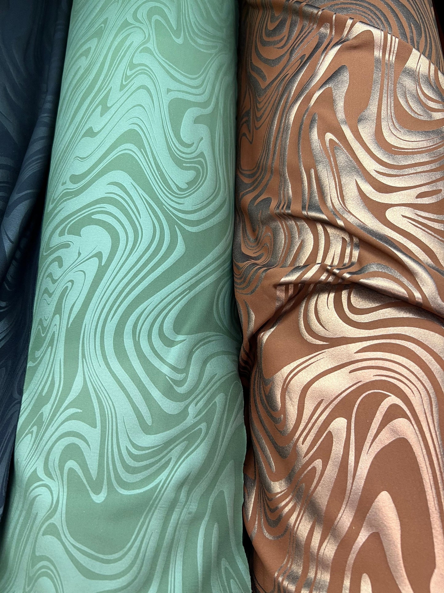 New Modern abstract design foiled nylon spandex 4 way stretch 58/60” Sold by the YD.