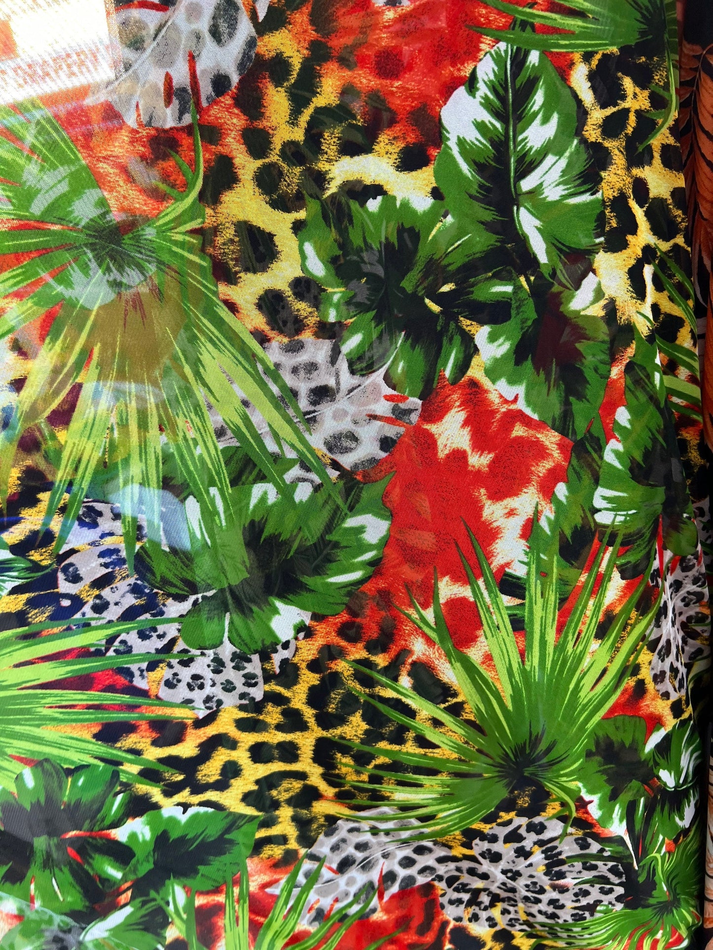 Exotic Hiding Cheetah design print on power mesh 4-way stretch 58/60” Sold by the YD. Ships Worldwide from Los Angeles California USA.