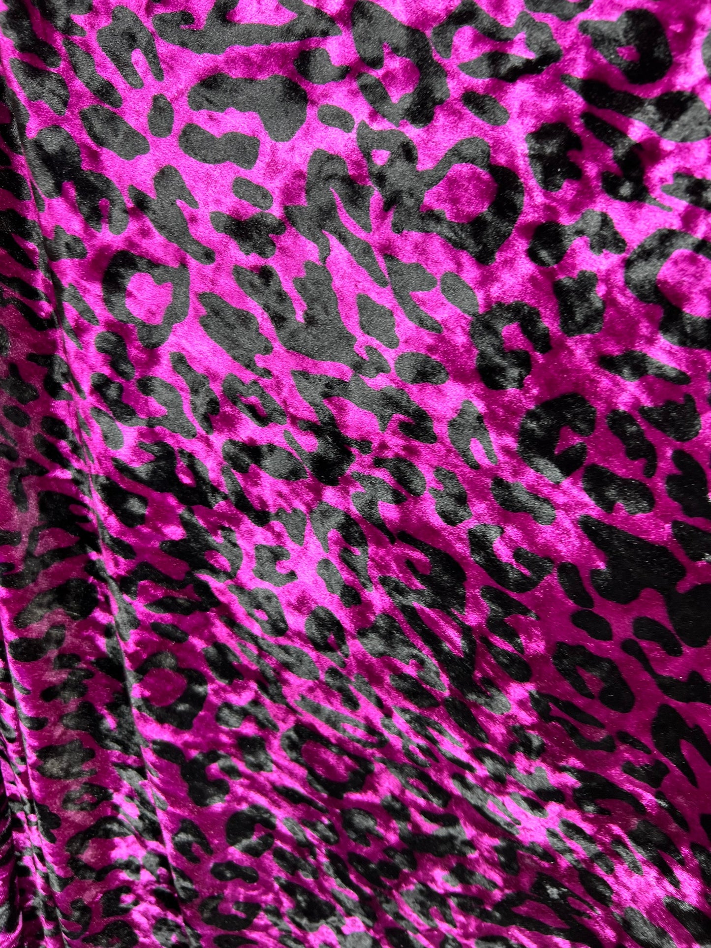 New Leopard design Magenta/Black exotic animal print on 4-way stretch velvet 58/60” Sold by the YD. Ships worldwide from Los Angeles CA