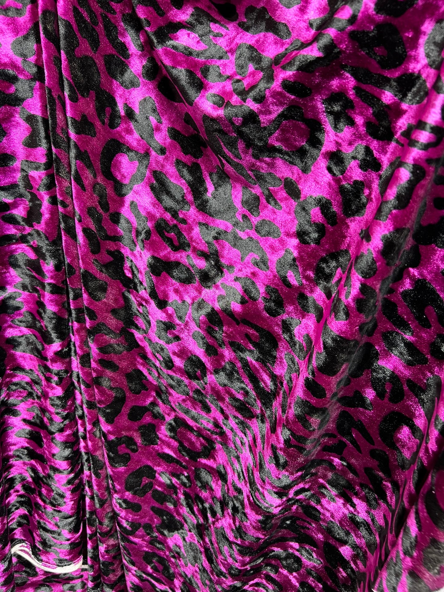 New Leopard design Magenta/Black exotic animal print on 4-way stretch velvet 58/60” Sold by the YD. Ships worldwide from Los Angeles CA