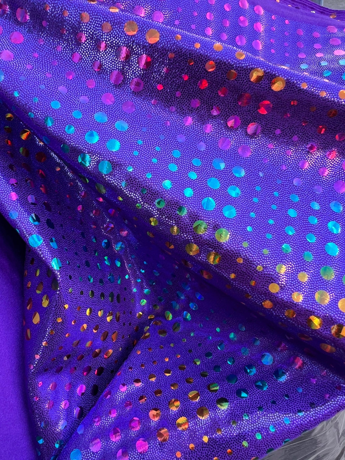 New Iridescent disco design Hologram purple on metallic Nylon spandex 4-way stretch 58/60” Sold by the YD. Ships Worldwide from Los Ángeles