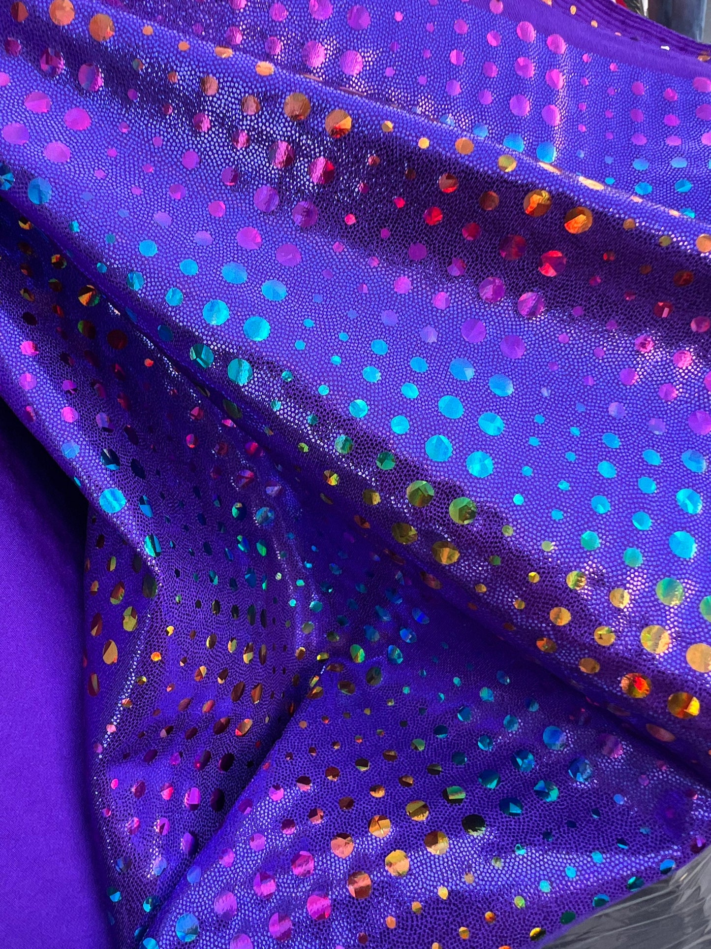 New Iridescent disco design Hologram purple on metallic Nylon spandex 4-way stretch 58/60” Sold by the YD. Ships Worldwide from Los Ángeles