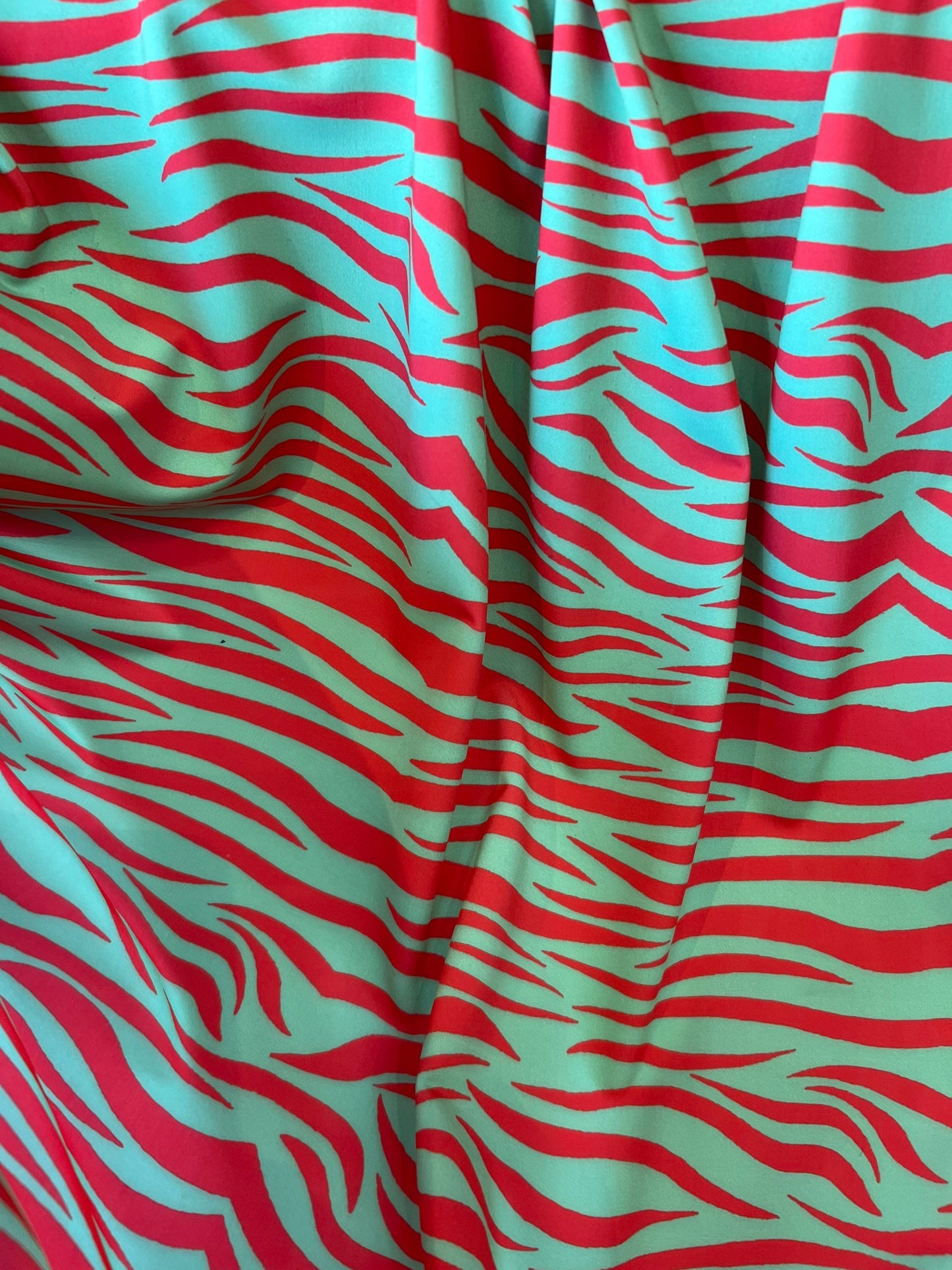 New Exotic zebra design Green/Red print on great quality of nylon spandex 4-way stretch 58/60” Sold by the YD. Ships Worldwide from L.A