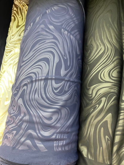 New Modern abstract design foiled nylon spandex 4 way stretch 58/60” Sold by the YD.