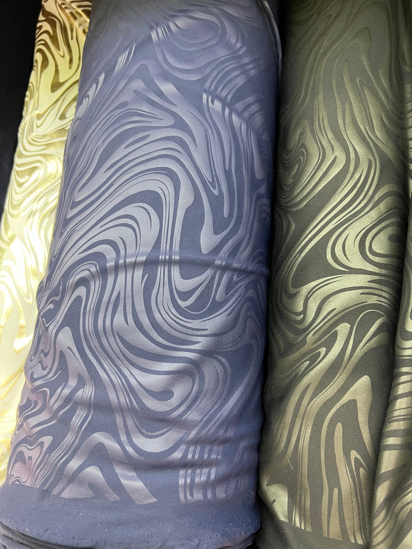 New Modern abstract design foiled nylon spandex 4 way stretch 58/60” Sold by the YD.