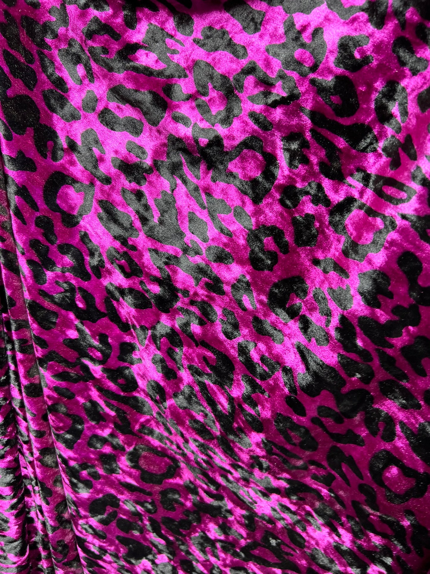 New Leopard design Magenta/Black exotic animal print on 4-way stretch velvet 58/60” Sold by the YD. Ships worldwide from Los Angeles CA