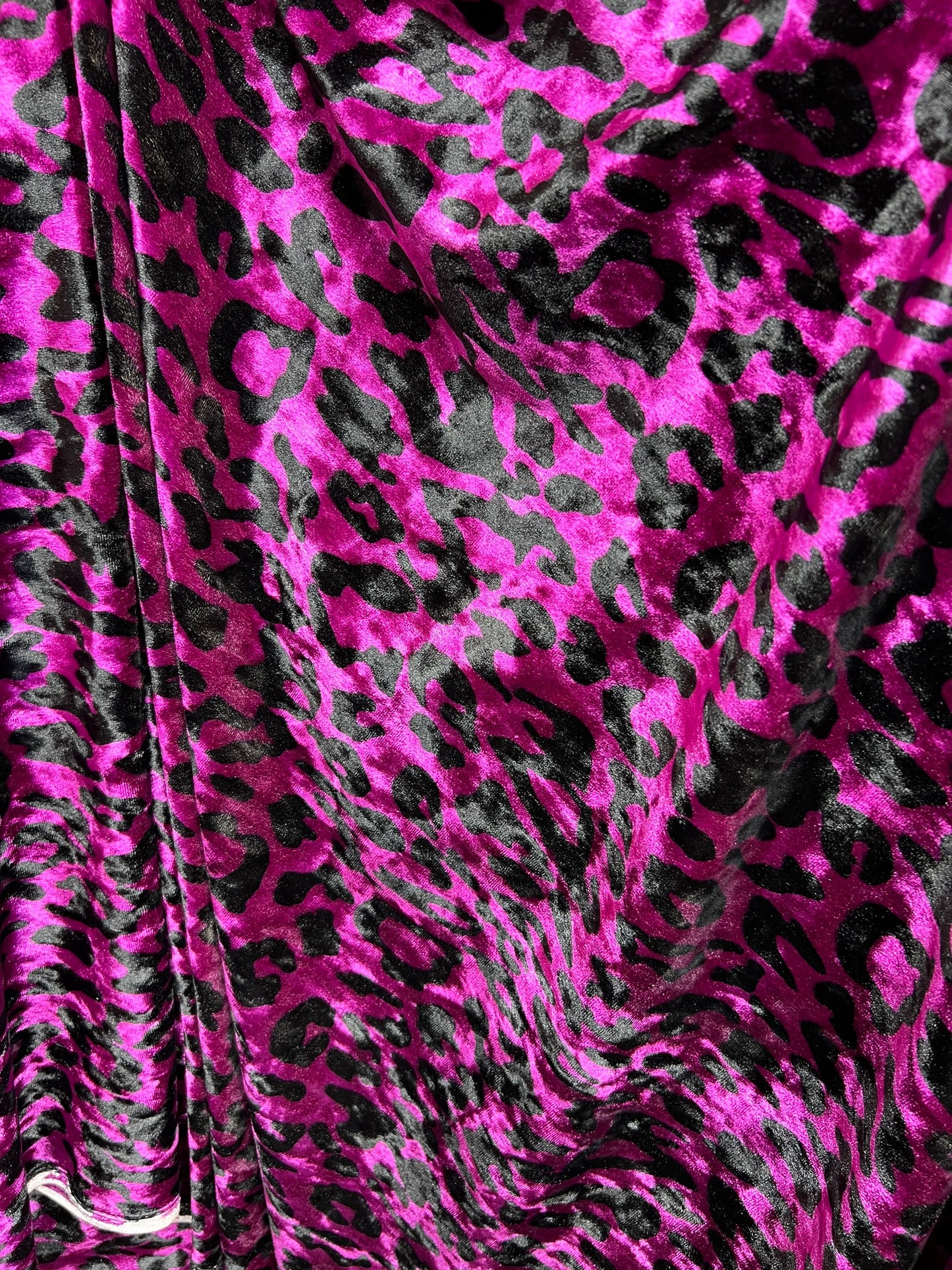 New Leopard design Magenta/Black exotic animal print on 4-way stretch velvet 58/60” Sold by the YD. Ships worldwide from Los Angeles CA