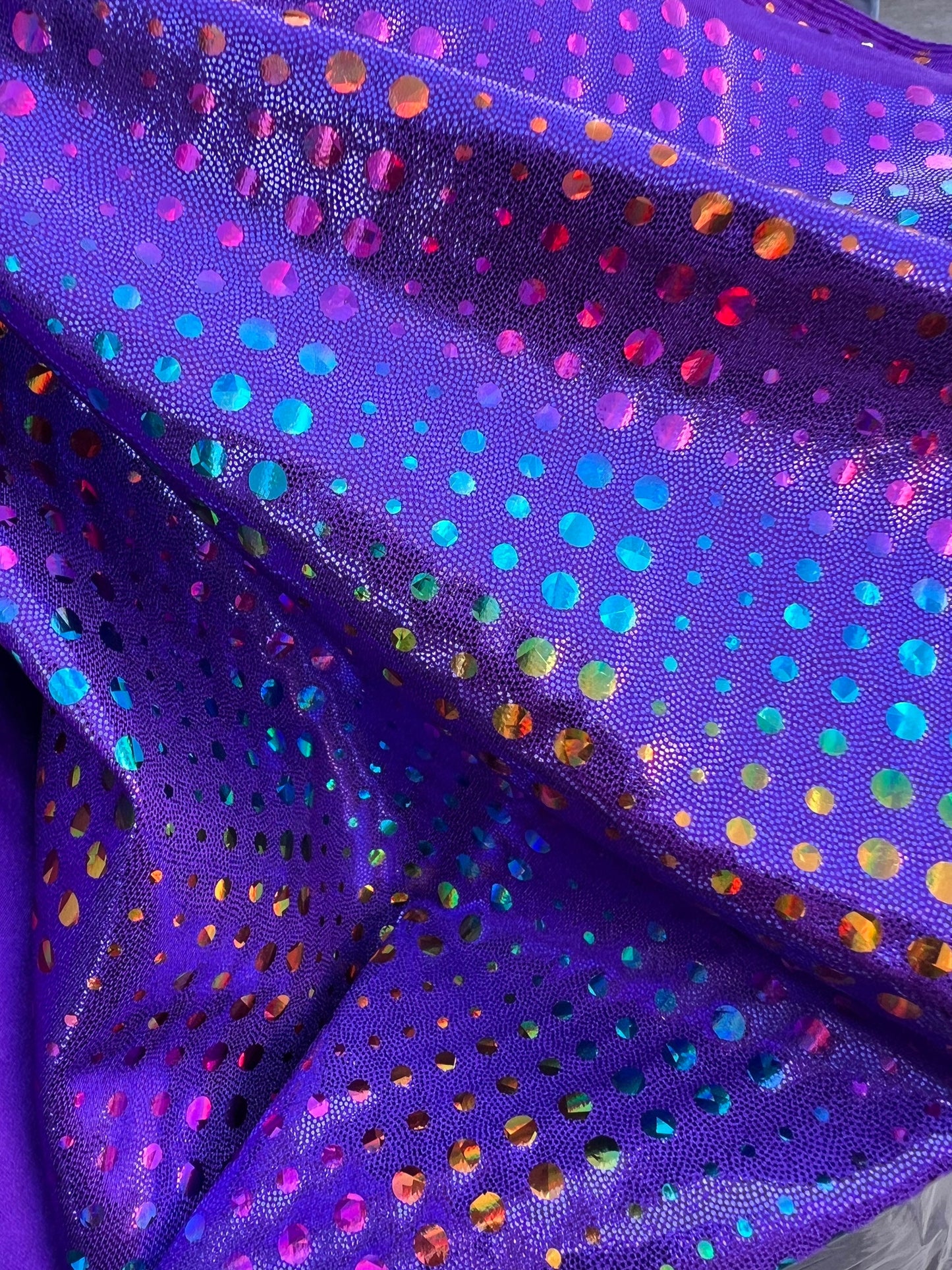 New Iridescent disco design Hologram purple on metallic Nylon spandex 4-way stretch 58/60” Sold by the YD. Ships Worldwide from Los Ángeles