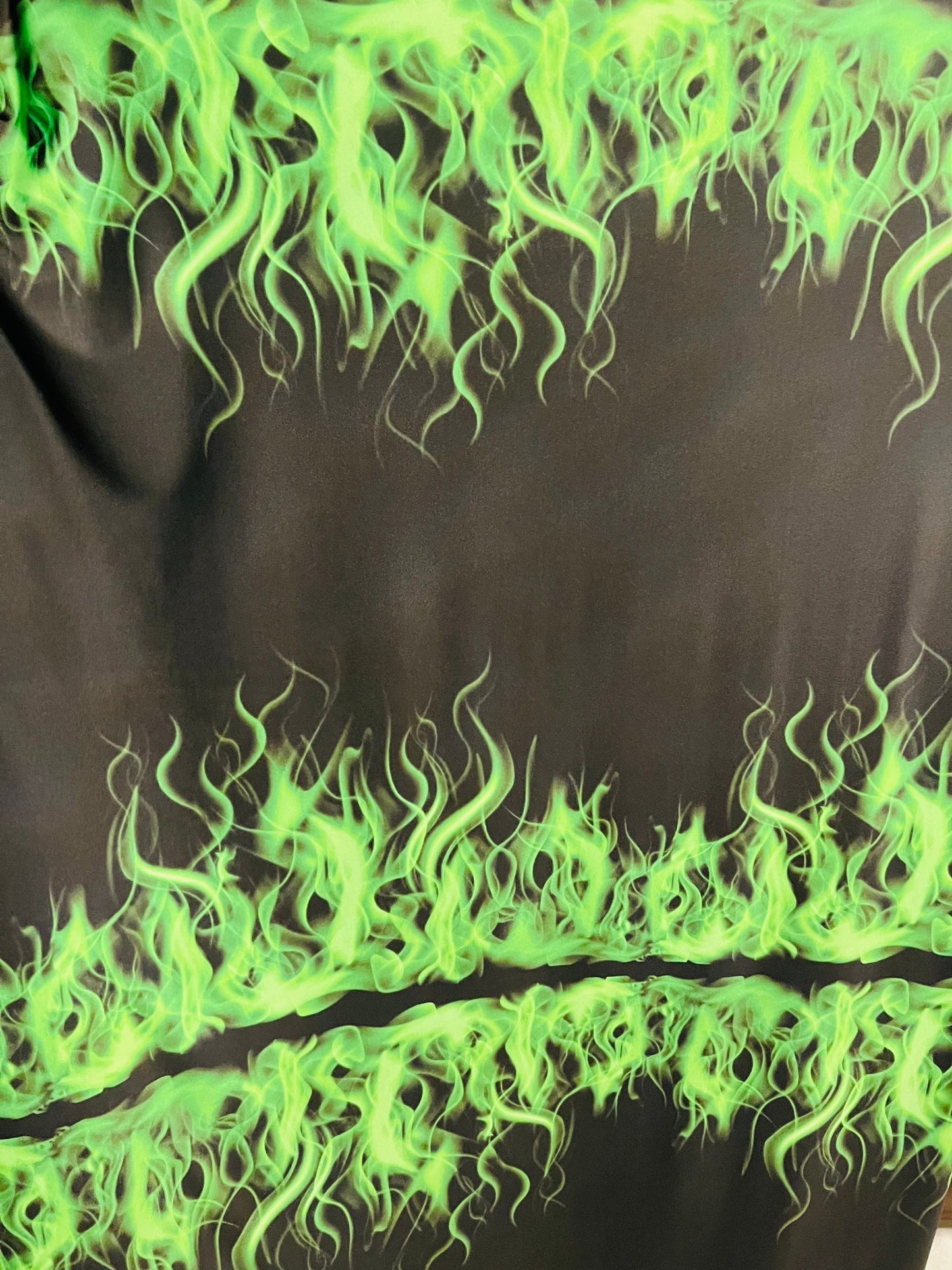 Flames design Black/Green print on great quality of Poly spandex 4-way stretch 58/60” Sold by the YD. Ships Worldwide from Los Angeles CA