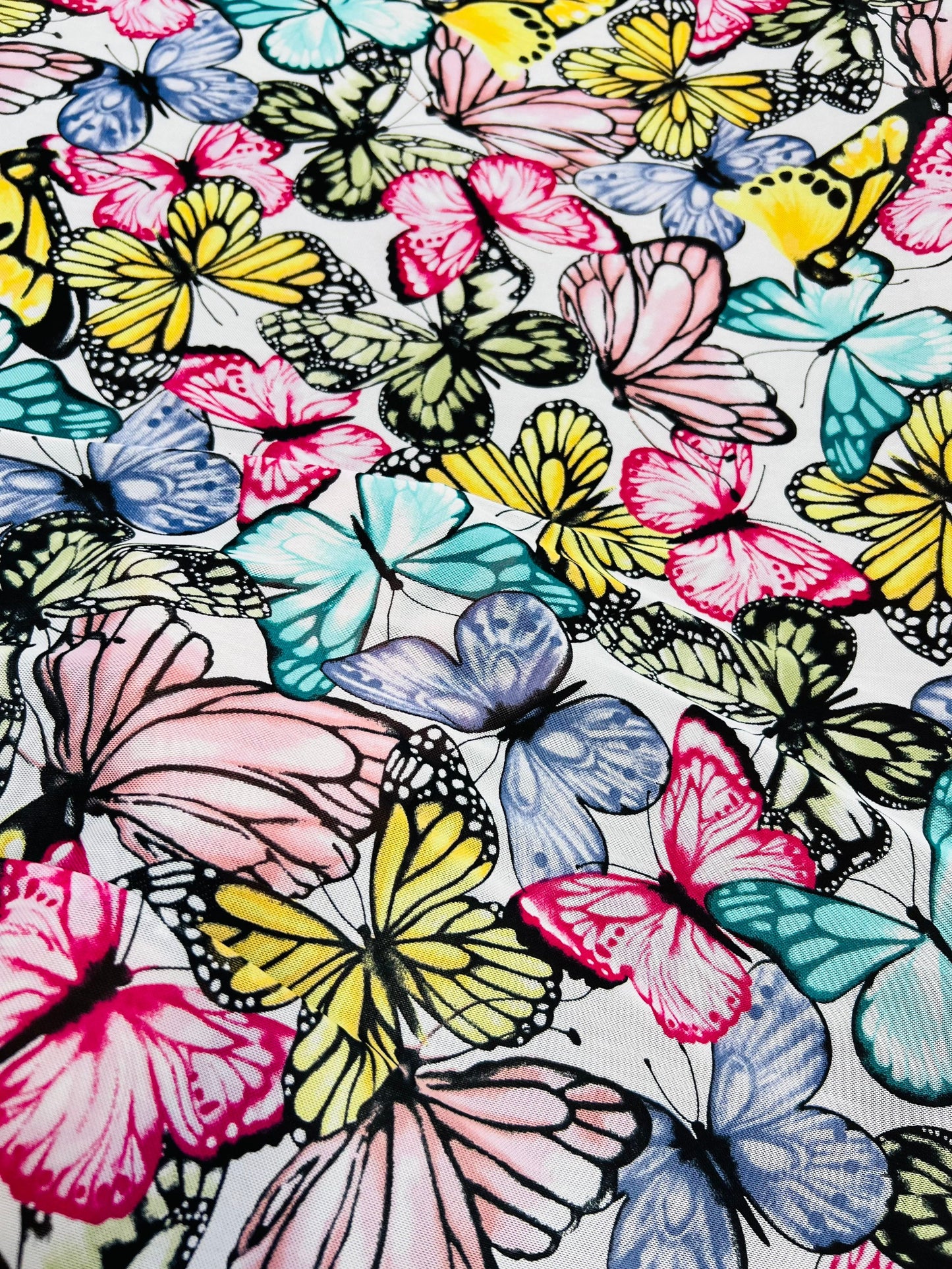 Butterfly design multicolor print on power mesh spandex 4-way stretch 58/60” Sold by the YD. Ships Worldwide from Los Angeles California USA