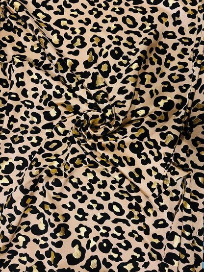 New exotic metallic leopard design nylon spandex 4-way stretch it glows in the dark 58/60” Sold by the YD. Ships worldwide from Los Angeles