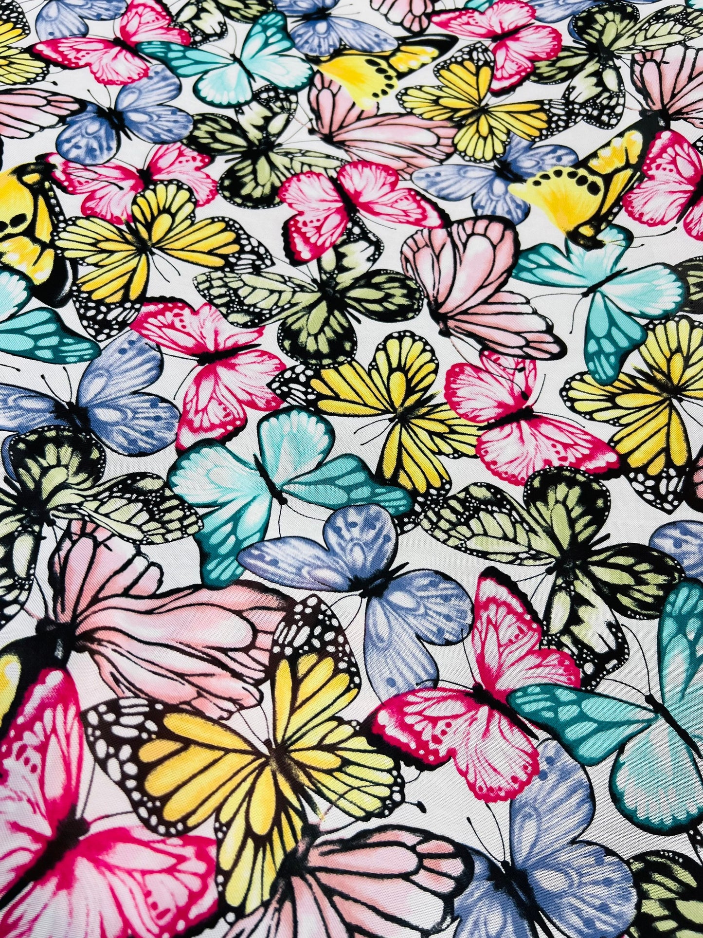 Butterfly design multicolor print on power mesh spandex 4-way stretch 58/60” Sold by the YD. Ships Worldwide from Los Angeles California USA