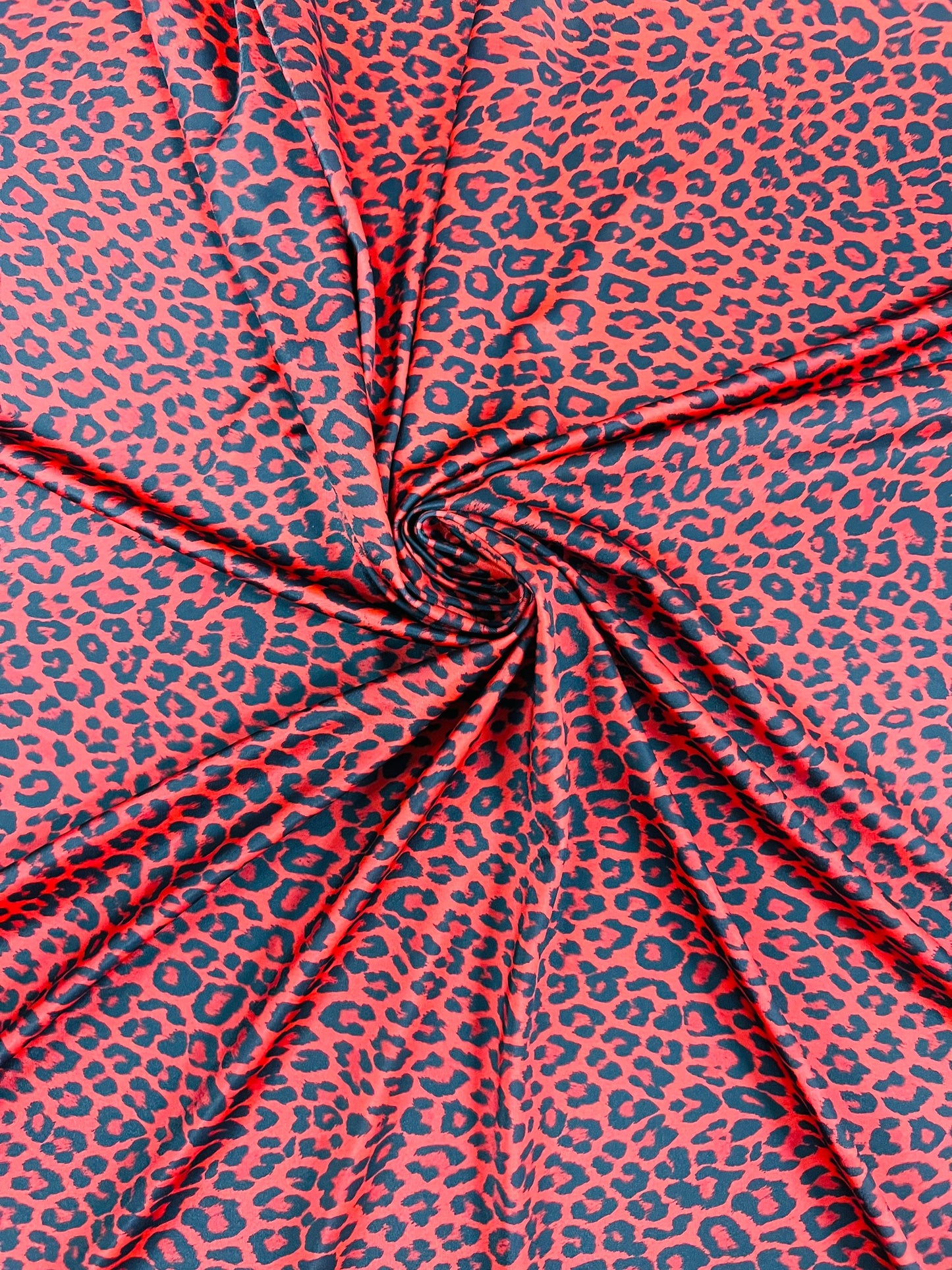 New Exotic Leopard design Red/Black print on great quality of Nylon spandex 4-way stretch 58/60” Sold by the YD. Ships Worldwide