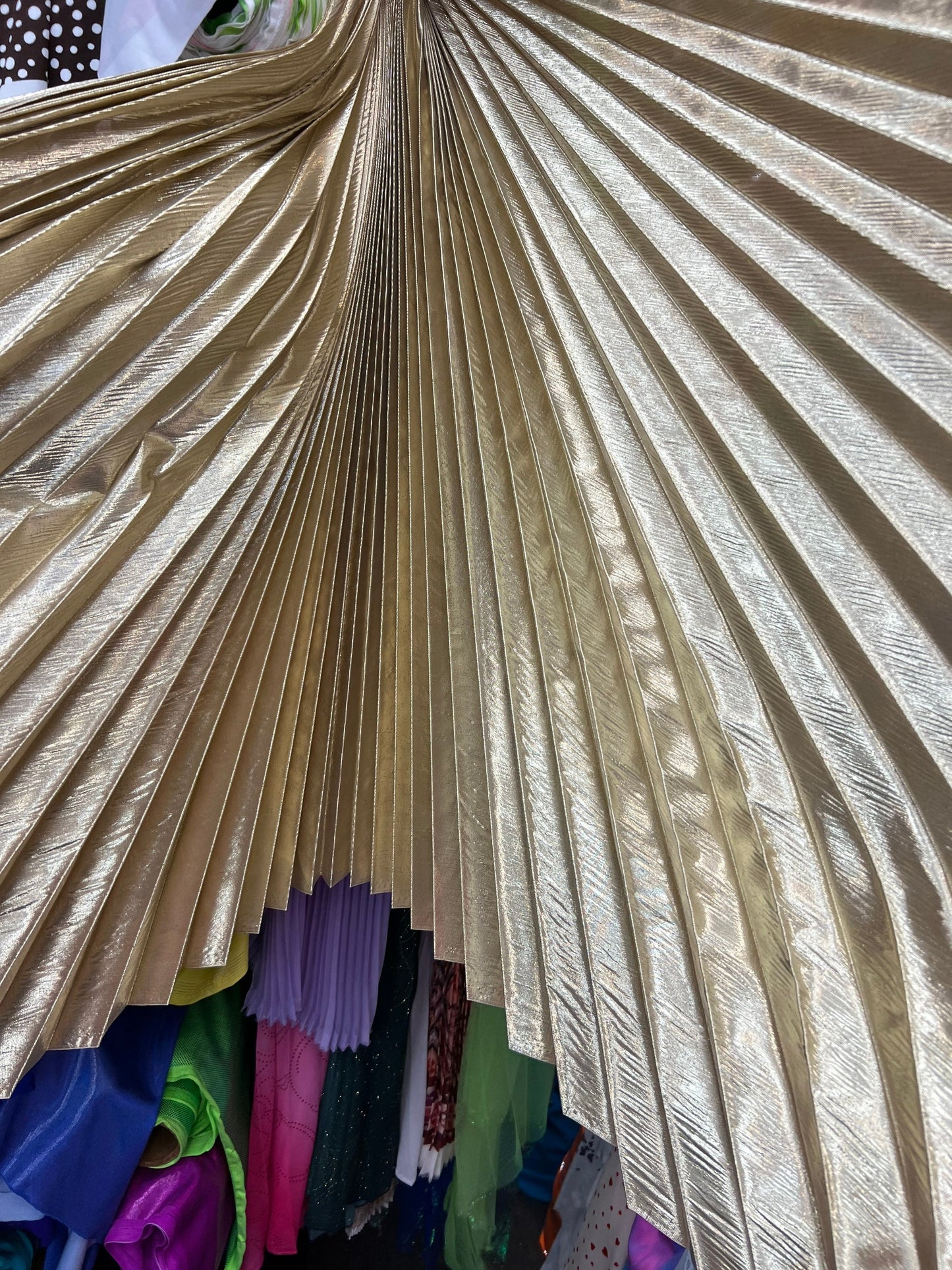 Sambers pleated metallic lame non stretch 108” length by 45” width Sold by the PC. Ships worldwide from Los Angeles California USA