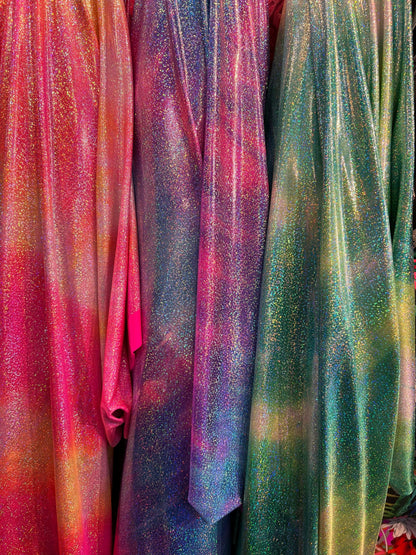 New tie dye design hologram metallic nylon spandex with foggy foil all over 4-way stretch 58/60” Sold by the YD. Ships worldwide