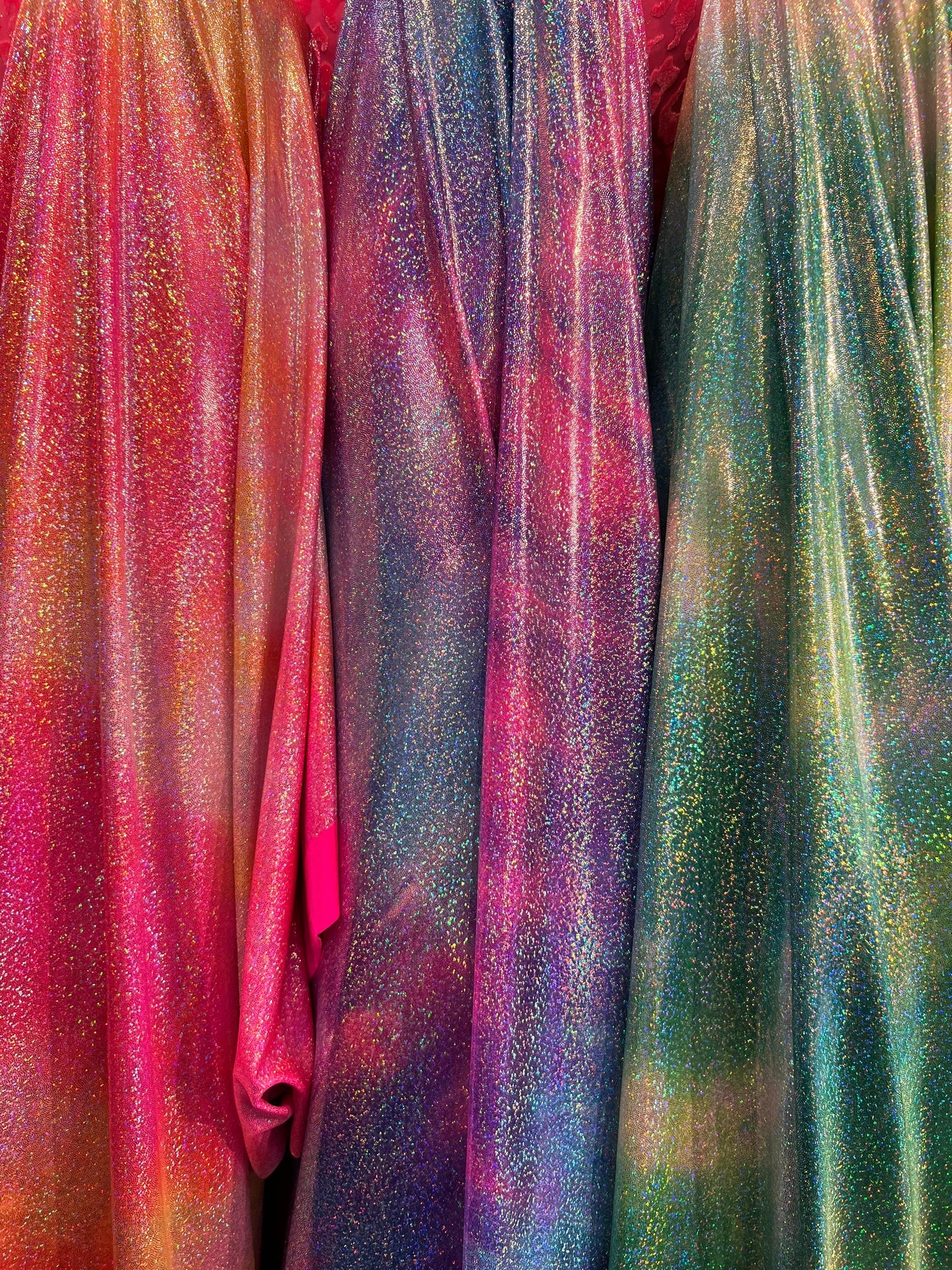 New tie dye design hologram metallic nylon spandex with foggy foil all over 4-way stretch 58/60” Sold by the YD. Ships worldwide