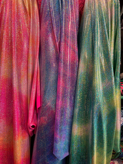 New tie dye design hologram metallic nylon spandex with foggy foil all over 4-way stretch 58/60” Sold by the YD. Ships worldwide