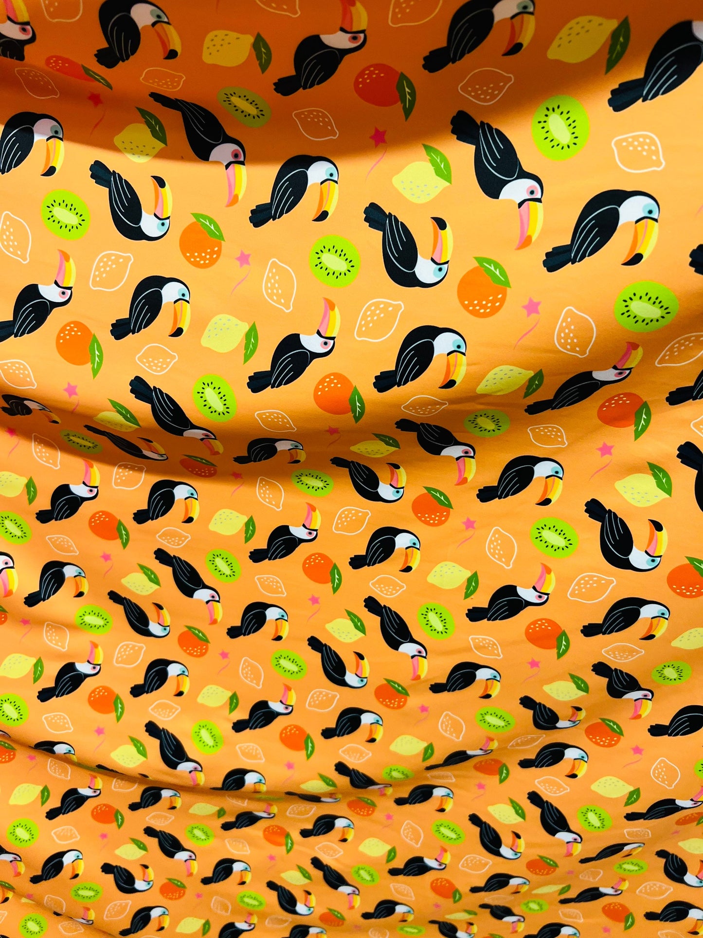 Toucan with tutti-frutti design print on great quality of Nylon spandex 4-way stretch 58/60” Sold by the YD. Ships worldwide