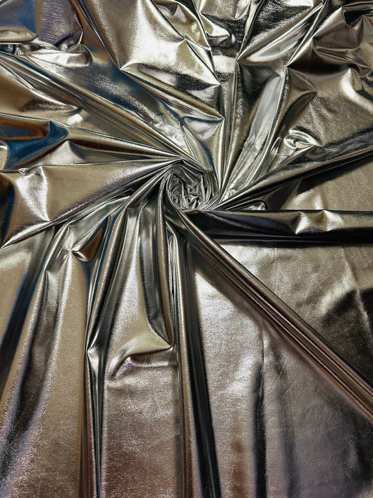 Super shiny all over foiled silver metallic lame poly spandex 4-way stretch 58/60” Sold by the YD. Ships worldwide from Los Ángeles Californ