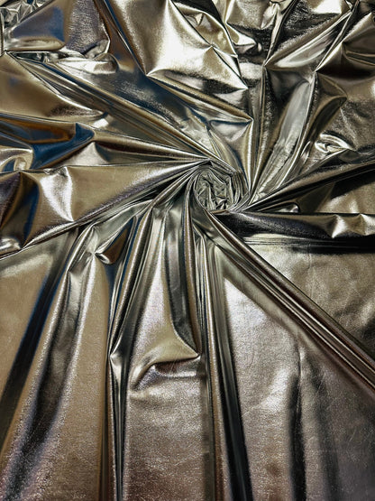 Super shiny all over foiled silver metallic lame poly spandex 4-way stretch 58/60” Sold by the YD. Ships worldwide from Los Ángeles Californ