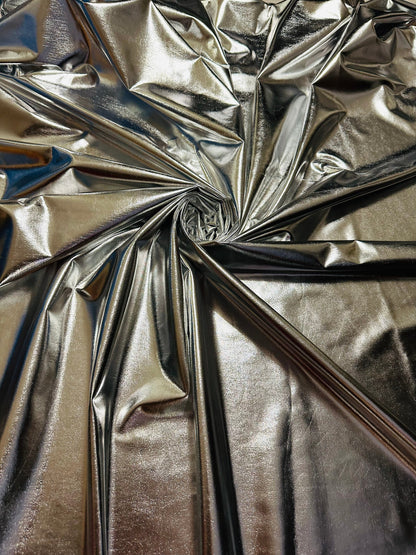 Super shiny all over foiled silver metallic lame poly spandex 4-way stretch 58/60” Sold by the YD. Ships worldwide from Los Ángeles Californ