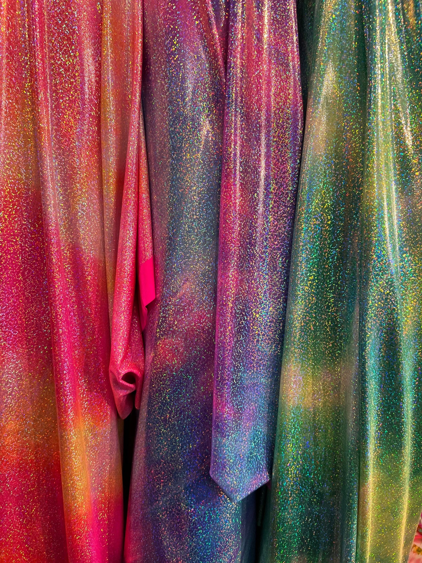 New tie dye design hologram metallic nylon spandex with foggy foil all over 4-way stretch 58/60” Sold by the YD. Ships worldwide