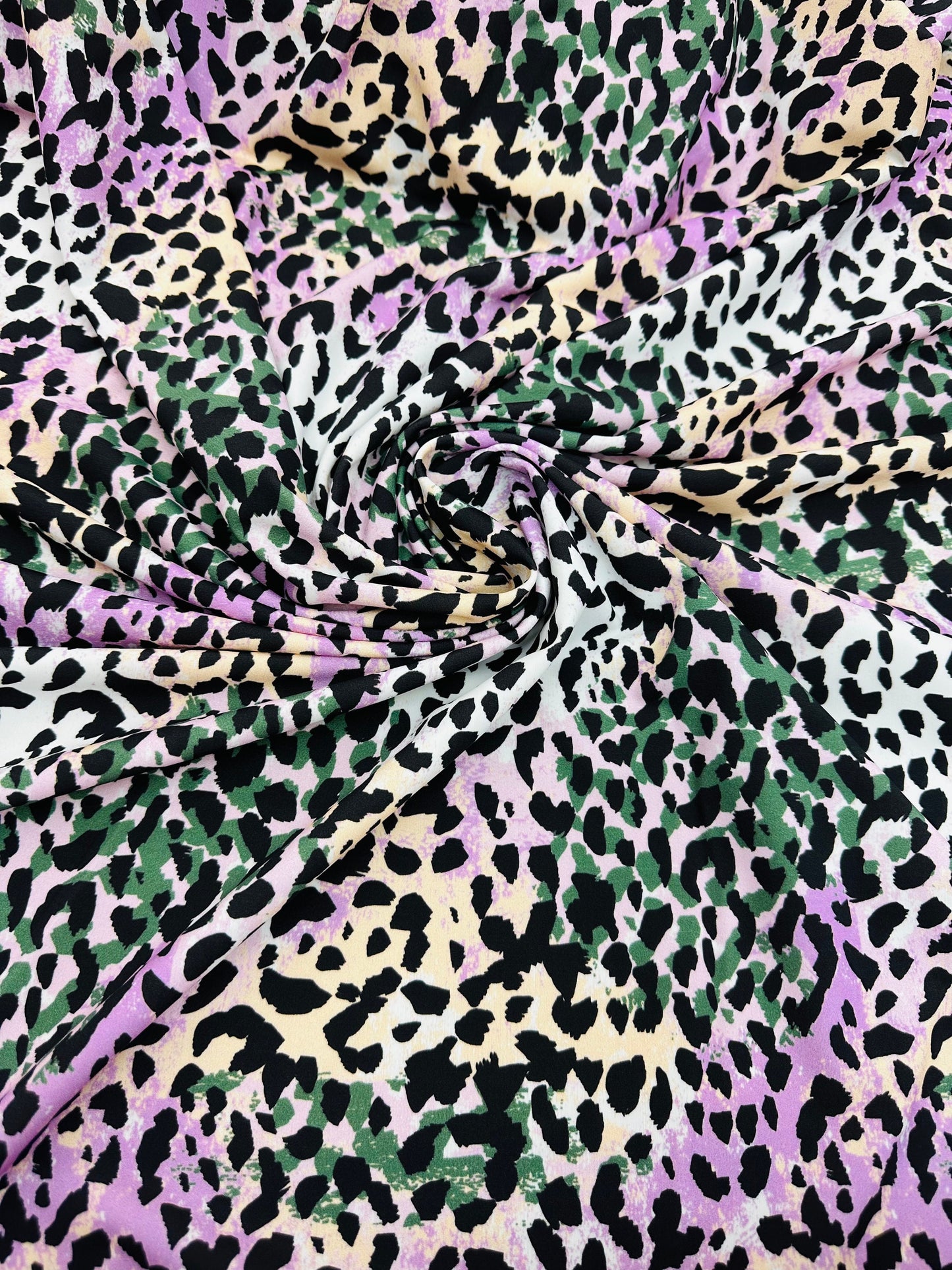 Exotic Leopard design multicolor nylon spandex 4-way stretch 58/60” Sold by the YD.