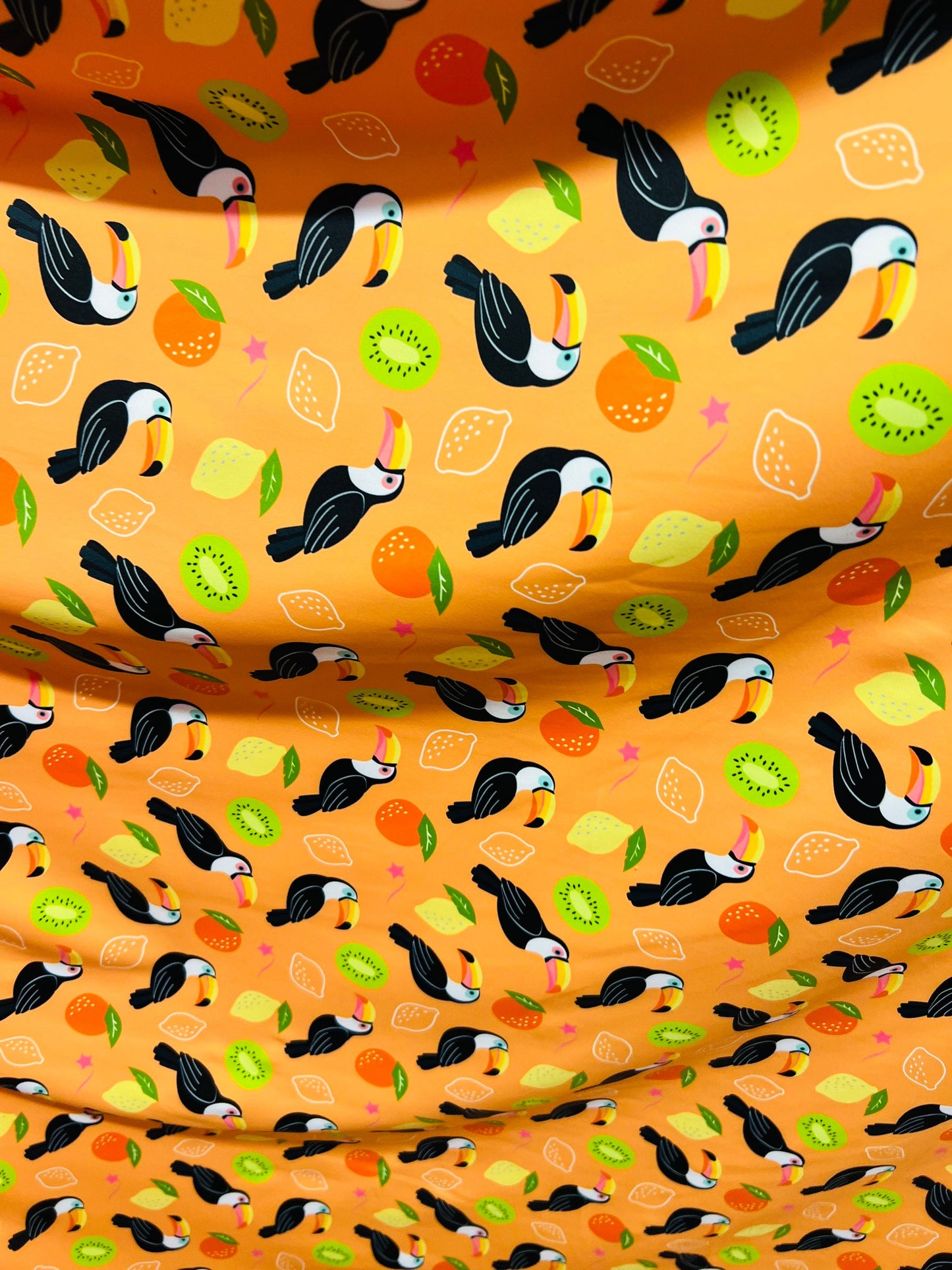 Toucan with tutti-frutti design print on great quality of Nylon spandex 4-way stretch 58/60” Sold by the YD. Ships worldwide