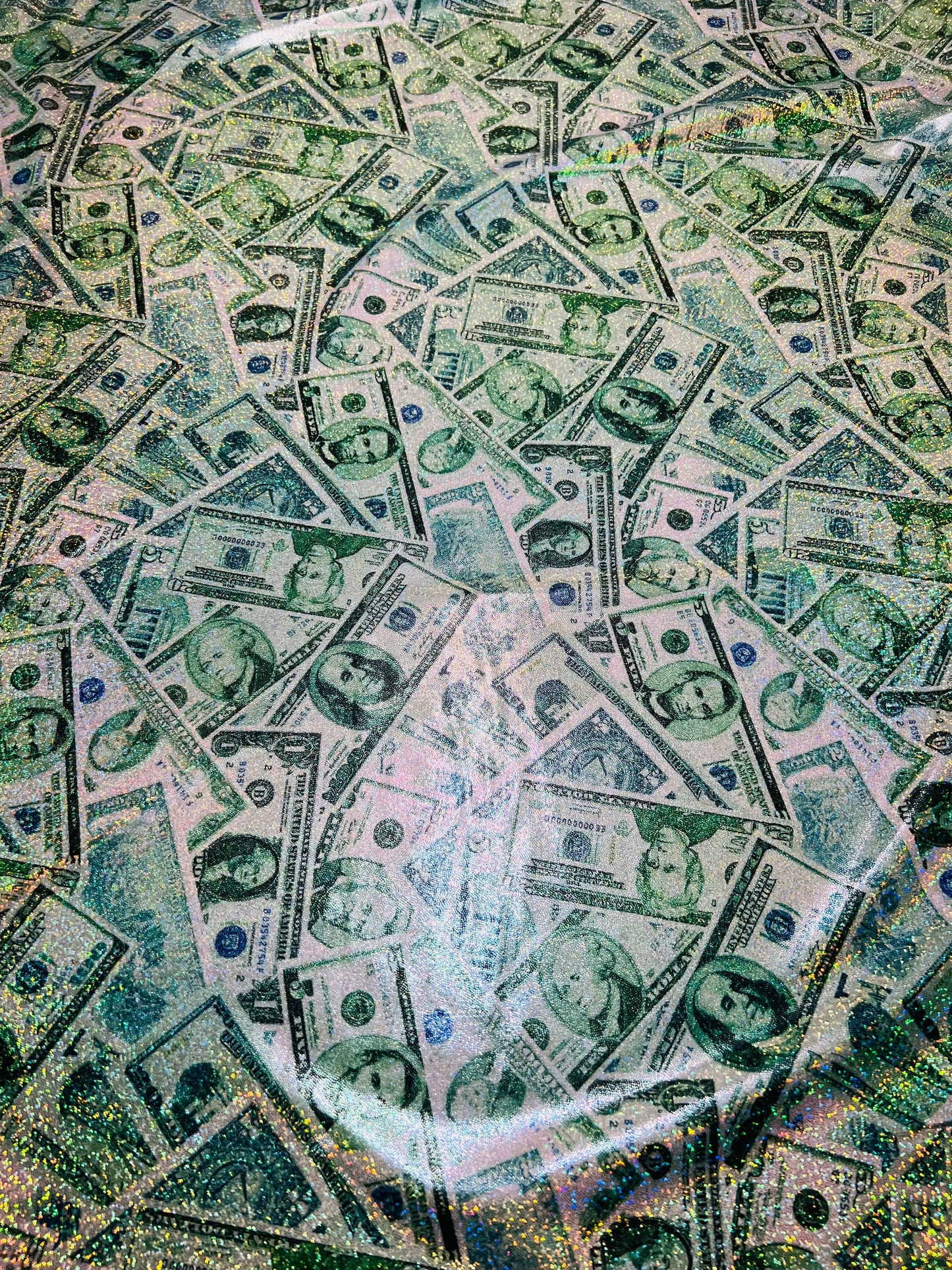 New Money design Multi dollars design hologram metallic tie dye nylon spandex 4-way stretch 58/60” Sold by the YD. Ships worldwide