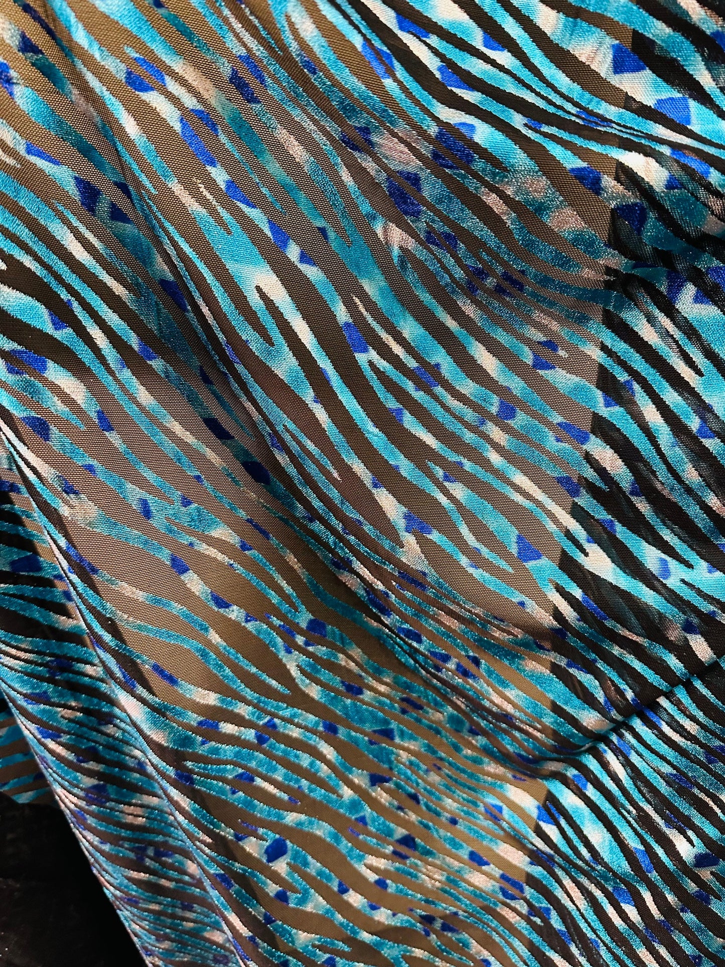 Exotic Zebra design peacock blue metallic hologram mesh 4-way stretch 58/60” Sold by the YD. Ships worldwide from Los Angeles California USA