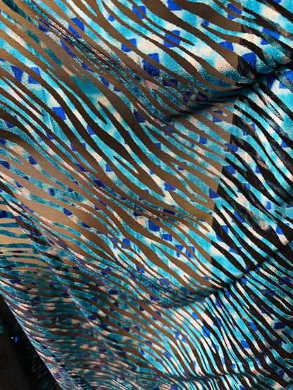 Exotic Zebra design peacock blue metallic hologram mesh 4-way stretch 58/60” Sold by the YD. Ships worldwide from Los Angeles California USA