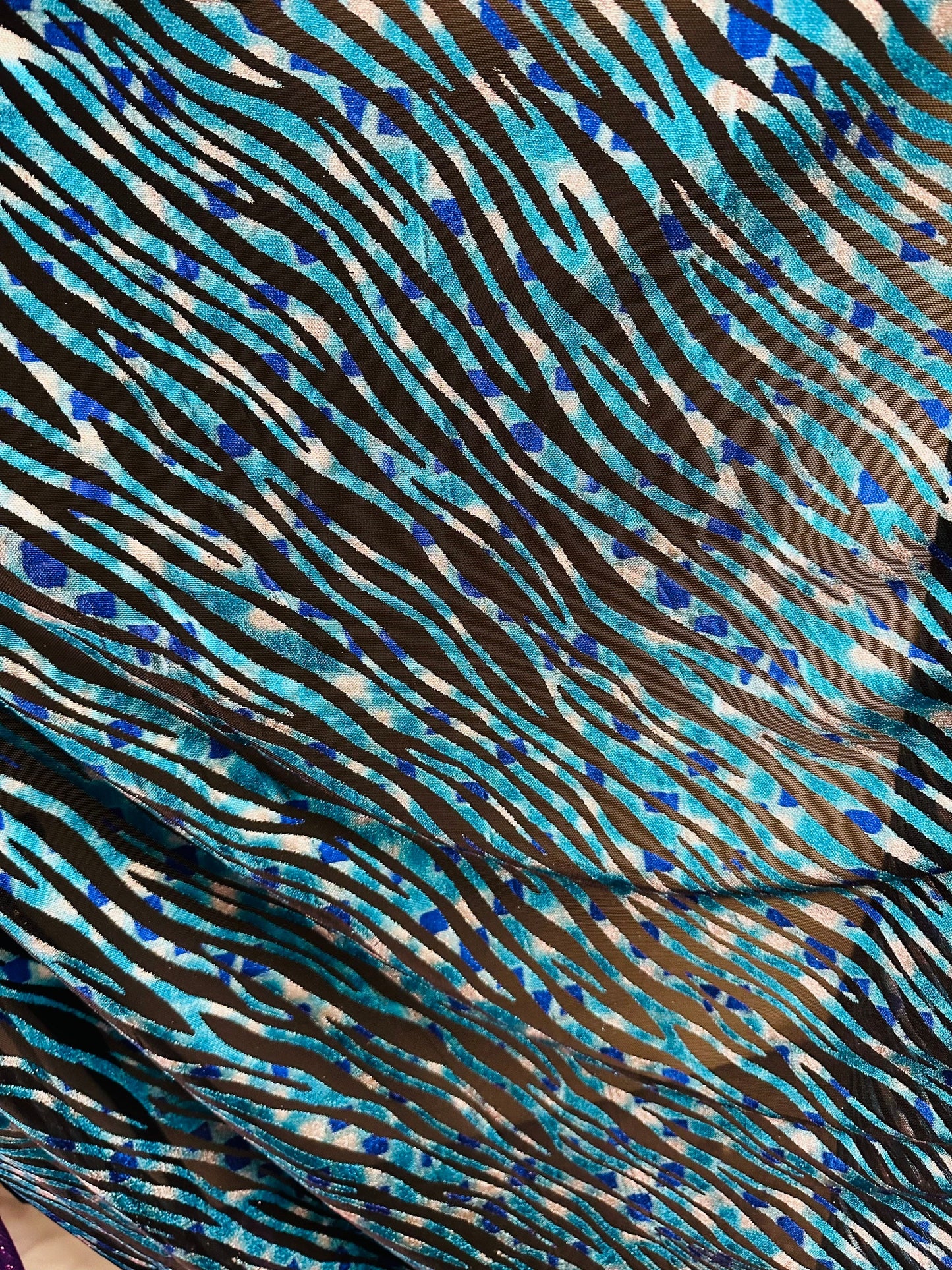 Exotic Zebra design peacock blue metallic hologram mesh 4-way stretch 58/60” Sold by the YD. Ships worldwide from Los Angeles California USA